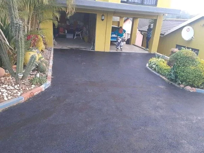 New tar driveway with proper drainage